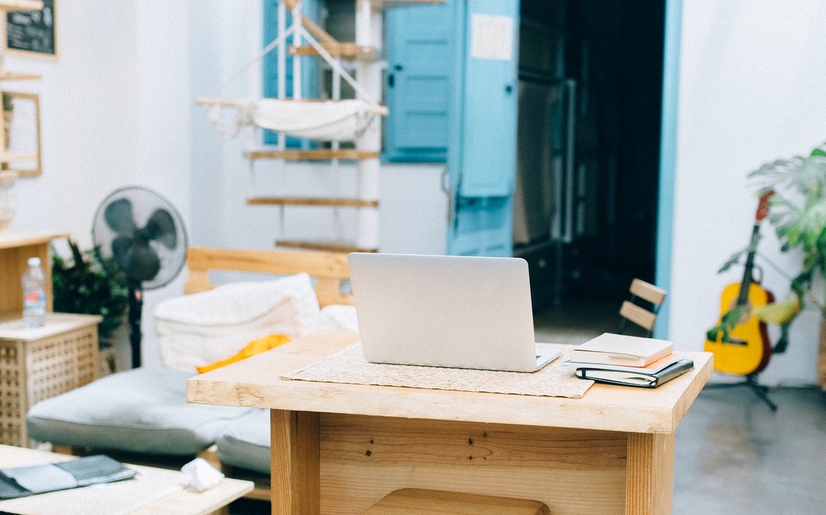 Photo by Nataliya Vaitkevich from Pexels: https://www.pexels.com/photo/white-laptop-computer-on-brown-wooden-table-in-spacious-room-5186300/